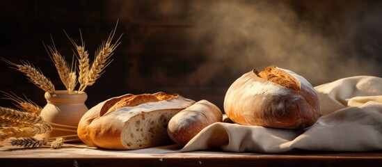 Wall Mural - Two bread loaves and a loaf on table