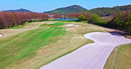 Wall Mural - Aerial view of golf course on sunny day