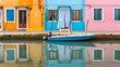 Colorful houses with reflections on the canal in Buran