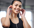 Girl, earphones and portrait at gym for fitness, music and motivation for workout or exercise. Female person, athlete listening and audio for cardio, sports and wellness podcast for training at club