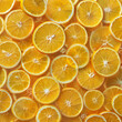 Fondo con detalle y textura de multitud de rodajas de naranjaq con aspecto fresco