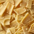 Fondo con detalle y textura de lonchas de queso parmesano