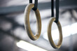 Gymnastic rings, gym and workout for aerobics, fitness and strong or power challenge for training. Equipment, tool and flexibility exercise or sports for wellness, arena and gear for competition