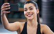 Selfie, smile and girl in gym, sportswear and training for health, strong and muscle for profile picture. Social media, athlete and woman with phone, happiness and workout in club, exercise and face