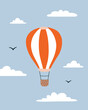 Hot air balloon vector illustration. Flying hot air balloon in the sky with clouds