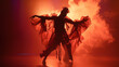 Modern dance performance featuring a choreography that interprets the struggle between good and evil, with the lead dancer representing the Devil in a striking costume.