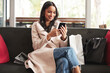 Woman, reading and shopping in city with phone notification of sale, info and scroll social media. Girl, customer and relax on sofa with smartphone for virtual retail, store and ecommerce website