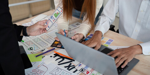 Wall Mural - brainstorm team of creative web graphic designer planning. creative designers present ux ui to team.