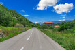 Rural road in the Adriatic region. Country road with rocky mountains in the background.