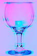 Wine glass closeup abstract in pink and blue neon