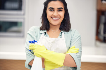 Poster - Cleaner, portrait and smile with gloves or confidence in house for cleaning, scrub and dirt on furniture. Indian woman, happy and housekeeping with detergent in bottle for dust in home or living room