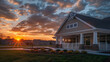 © Ayesha ibrahim - Sunset beautifully illuminating a new community clubhouse with a white porch and gable roof, in ultra high definition.
