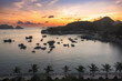 Sea bay in Vietnam with many fishing boats on sunset. View from above
