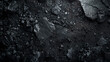 Charcoal texture, black shards and dust, dark abstract background