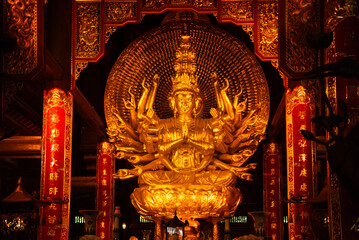 Wall Mural - Buddha statue in a hindu temple in Vietnam