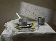 Modern still life with vintage aluminum cookware on a gray background