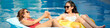 © DragonImages - Web banner with mother and daughter relaxing in swimming pool