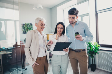 Wall Mural - Photo of business people women guy reading document clipboard analyze in workstation