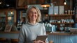 © Studio Nova - Smiling Woman Holding Tablet