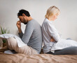 Unhappy sad couple, young family, bearded man, woman, husband, wife sit on bed, turned away back to back. Unlove crisis, sexual problem issues, relationship conflict, divorce - concept image