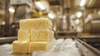 Stacks of butter in a factory setting.