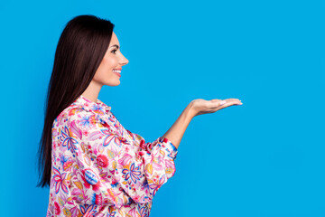 Poster - Photo of dreamy cute lady dressed print blouse holding arms emtpy space isolated blue color background