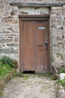A locked door in a ruin
