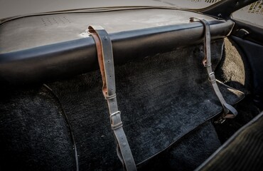 Canvas Print - Leather luggage straps in a car