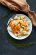 Fresh Citrus and Banana Fruit Salad Served on a White Plate With a Rustic Background