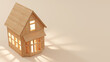 Wooden toy house on plain background with copy space. Wooden miniature with warm lighting and cozy vibes. 3d rendering