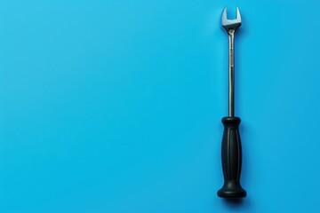 Wall Mural - A hammer on a blue background. Suitable for construction or DIY projects