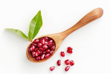 Wall Mural - Fresh pomegranate seeds and leaves on a wooden spoon, perfect for food and health concepts