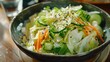 A healthy bowl of salad with cucumber, carrots, and sesame seeds. Perfect for health and wellness blogs or recipe websites