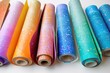 Colorful rolls of paper lined up together, ideal for crafts or art projects