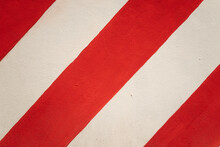 A Red And White Striped Wall With A Red Stripe On The Left And A White Stripe