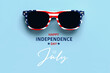 Happy Independence day July 4th. Closeup of USA flag sunglasses with text Happy Independence day July 4th