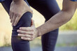 © peopleimages.com - Person, hand and knee or joint pain for running with inflammation problem, marathon or cardio. Legs, fingers and athlete with torn cartilage or tendonitis injury with meniscus, fracture or fitness