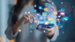 ©  J. GALIÑANES STOCK - A smartphone with app and social network icons in a virtual or holographic way, in the hands of a woman. Concept of communications, social networks and electronic devices.