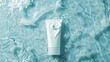 White skincare product tube on a watery turquoise background