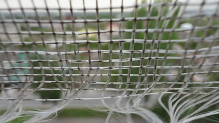 Old torn mosquito net close-up.