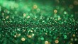   A tight frame of a green and gold glitter background, densely adorned with numerous tiny circles at its peak