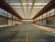 A large empty warehouse with a lot of windows. Scene is one of emptiness and loneliness
