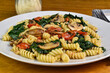 rotini served with spinach , mush rooms and tomatoes,