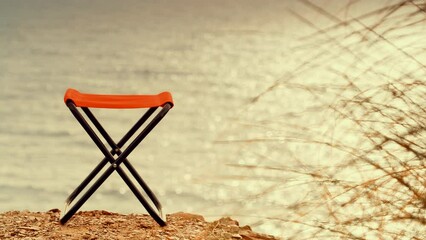 Canvas Print - Empty folding camp chair on beach nature. Holidays relaxation on trip. Vacation in the camping. Freedom and travel concept.