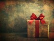 Old-style wrapped gift with red ribbon on a grunge texture background.