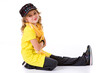 Dance: Little Girl Hip Hop Dancer with Smile Sitting On Ground