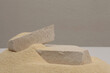 White Stones platform podium on beige sand light background. Minimal empty display product presentation scene.