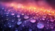   A glass surface bore close-up water droplets against blurred hues of red, yellow, and purple in the background