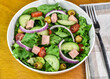 salad top with tomatoes cucumbers and  spam