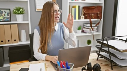 Wall Mural - Furious blonde business worker in office, shouting loud and clear, a young woman's screaming communication from the side with hand over mouth